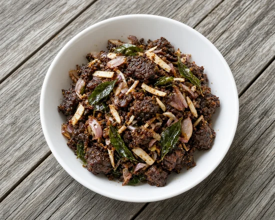 Beef Varattiyath with fried curry leaves and sliced shallots